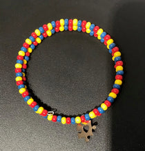 Load image into Gallery viewer, Autism Awareness red, yellow and blue Czech seed beads Beaded Bracelet with puzzle charm. Easy to put on and take off made with memory wire.
