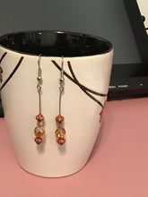 Load image into Gallery viewer, Topaz coloured with red and gold accent beads Dangle Earrings, Handmade in Canada, almost East Asian inspired.

