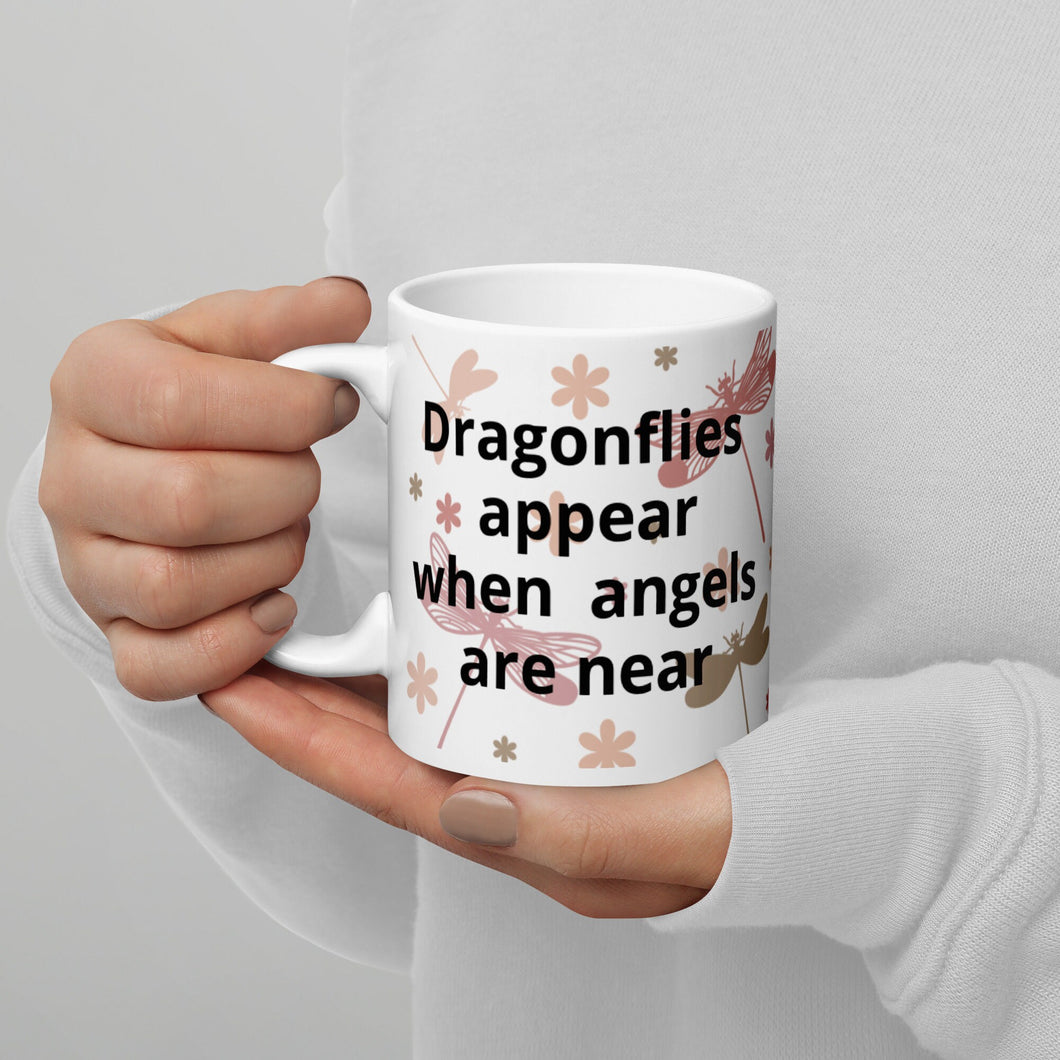 Dragonflies appear when angels are around. White glossy mug