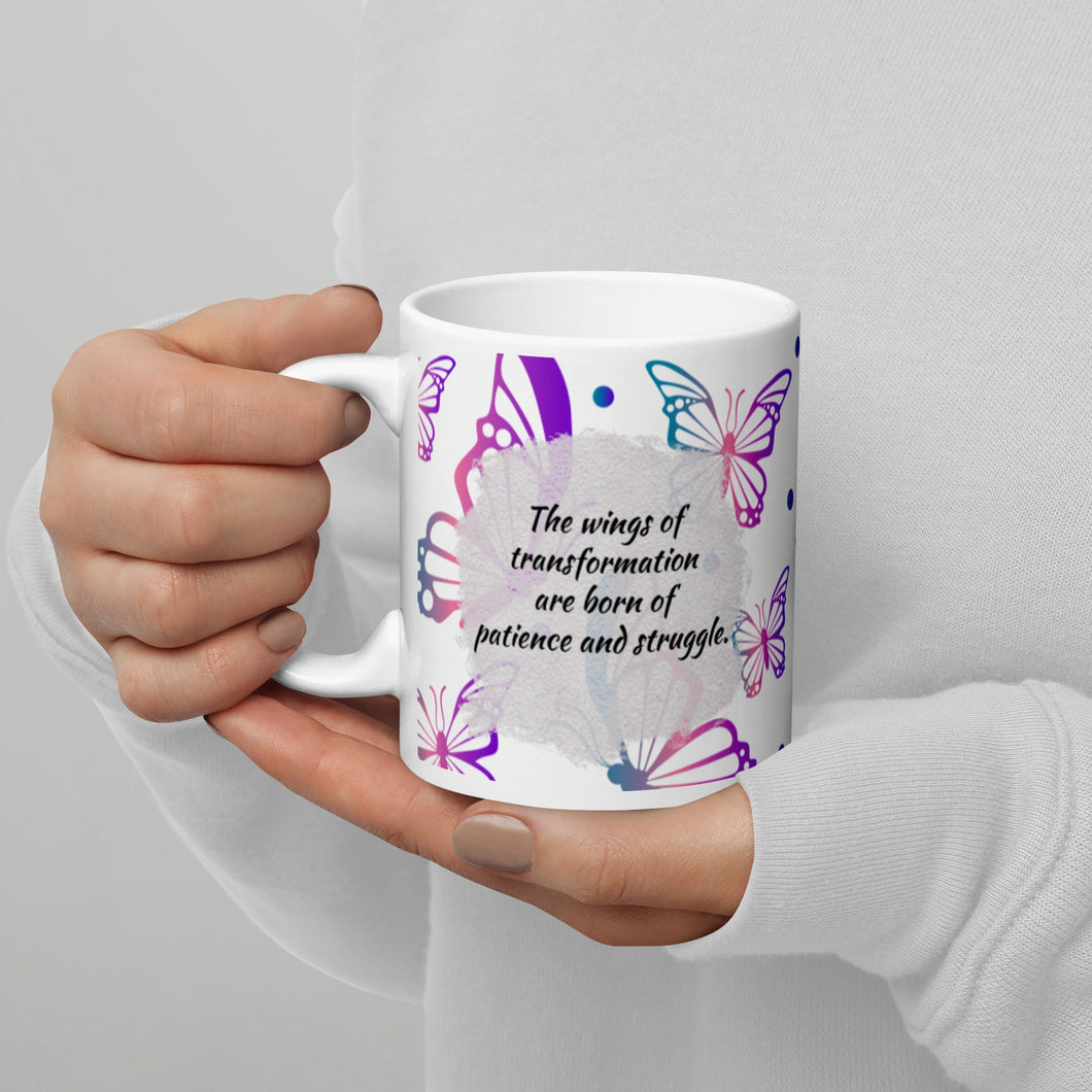 Wings of transformation are born of patience and struggle White glossy mug