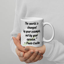 Load image into Gallery viewer, The world is changed by your example, not by your opinion.” – Paulo Coelho White glossy mug
